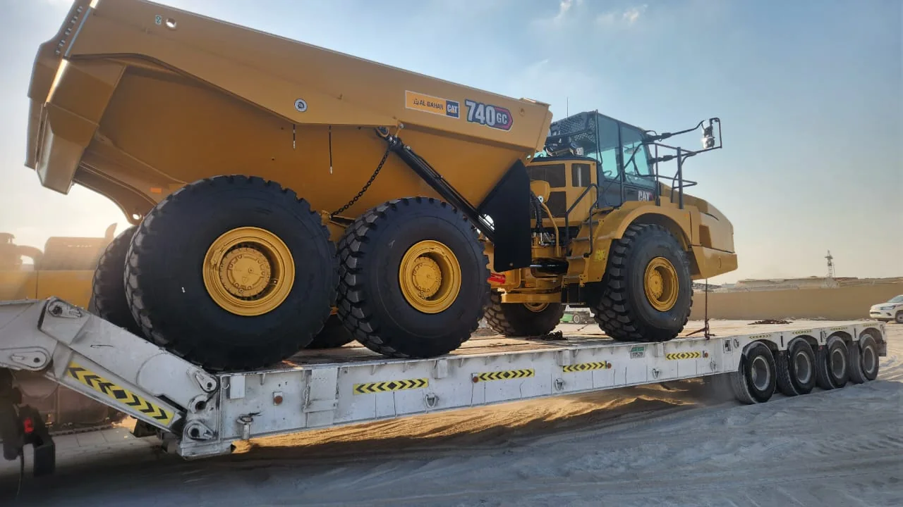 CAT 740 GC articulated hauler secured on a lowbed trailer