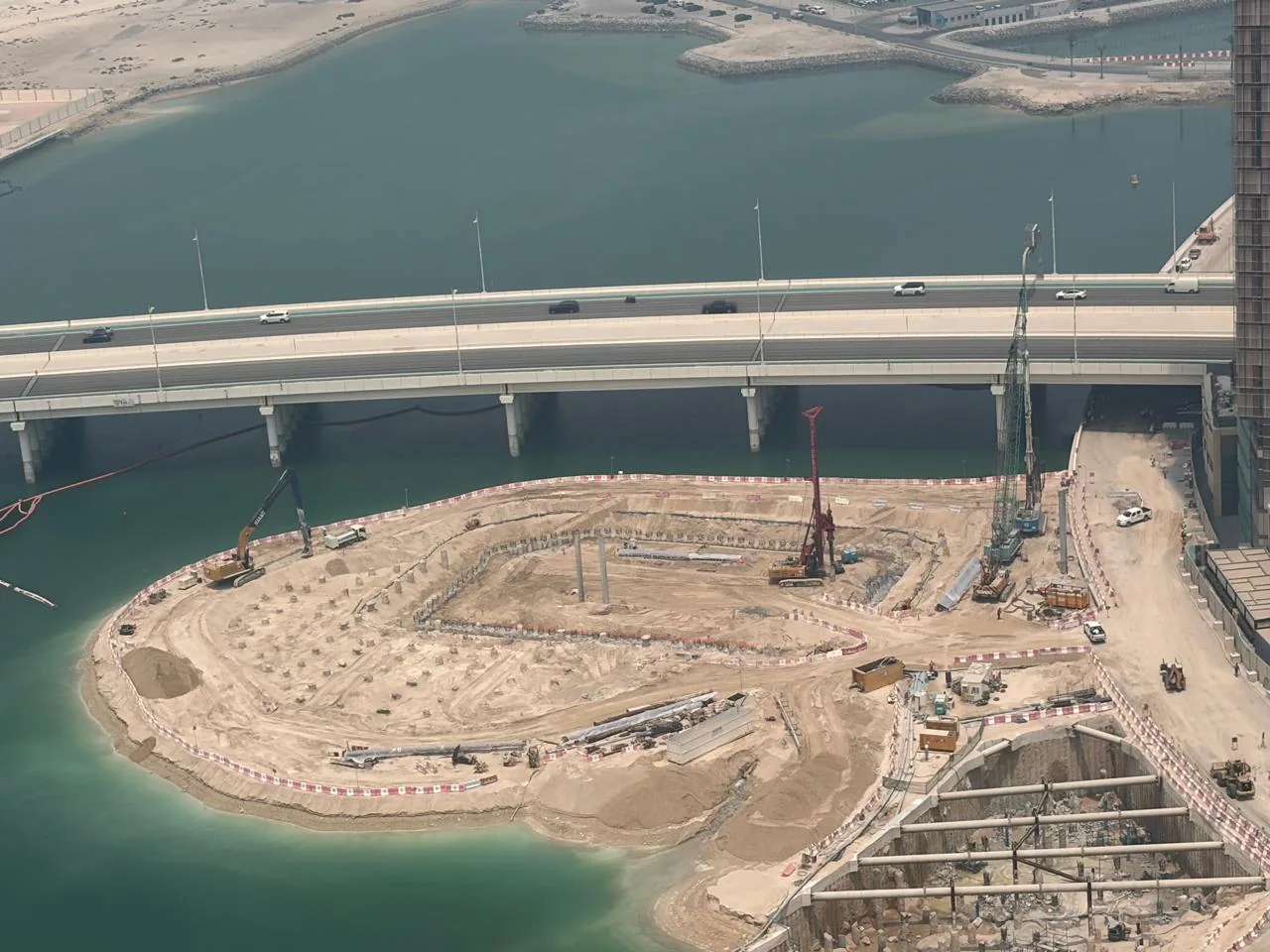Elevated view of the Al Maryah Project Dive work site beside a bridge.