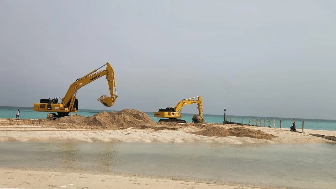 Excavators working on the sand at Soul Beach.